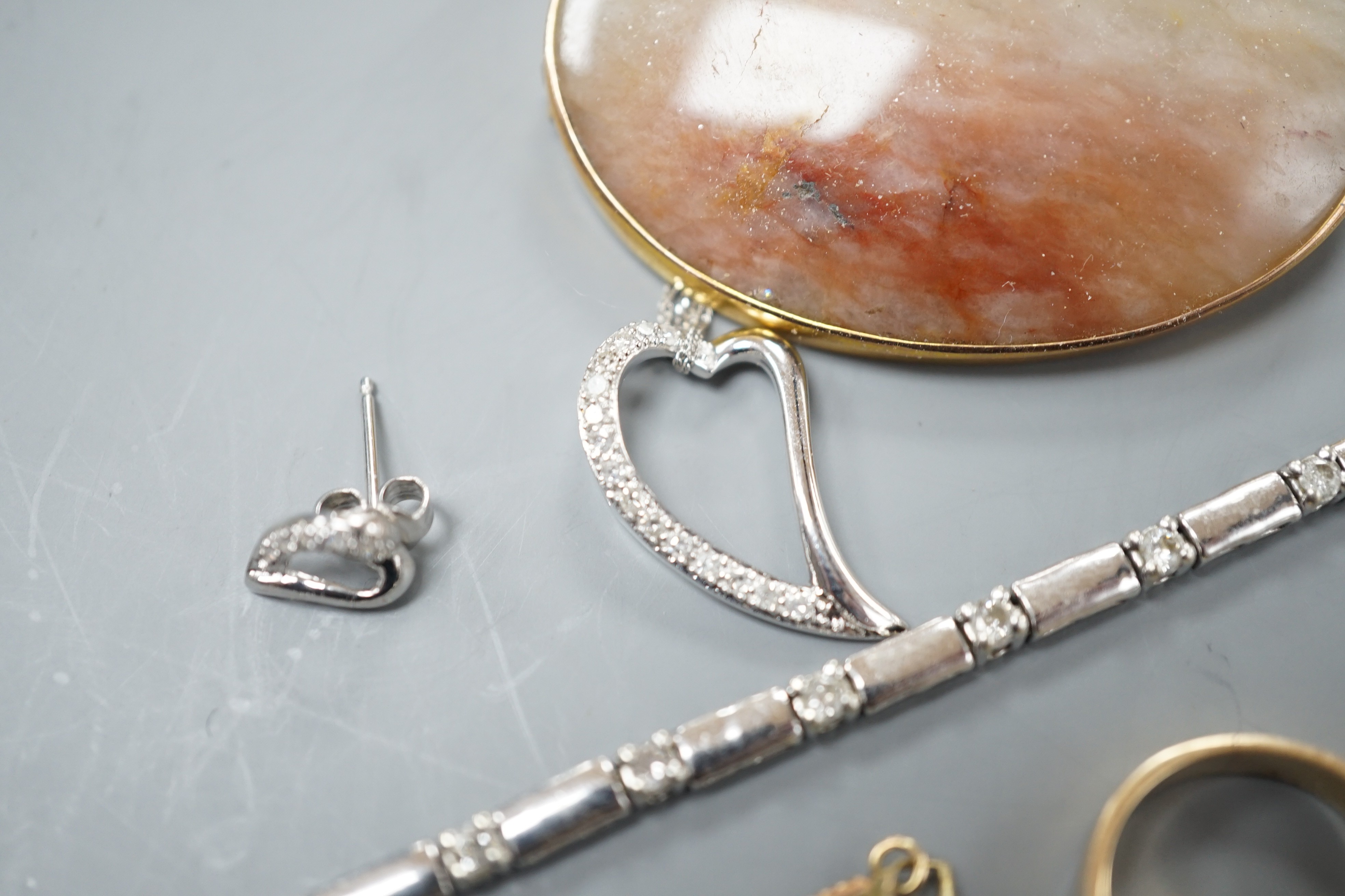 A 9kt white metal and diamond set bracelet, a 9ct mounted agate brooch, two rings including 18k, two pendants and a pair of modern diamond set ear studs.